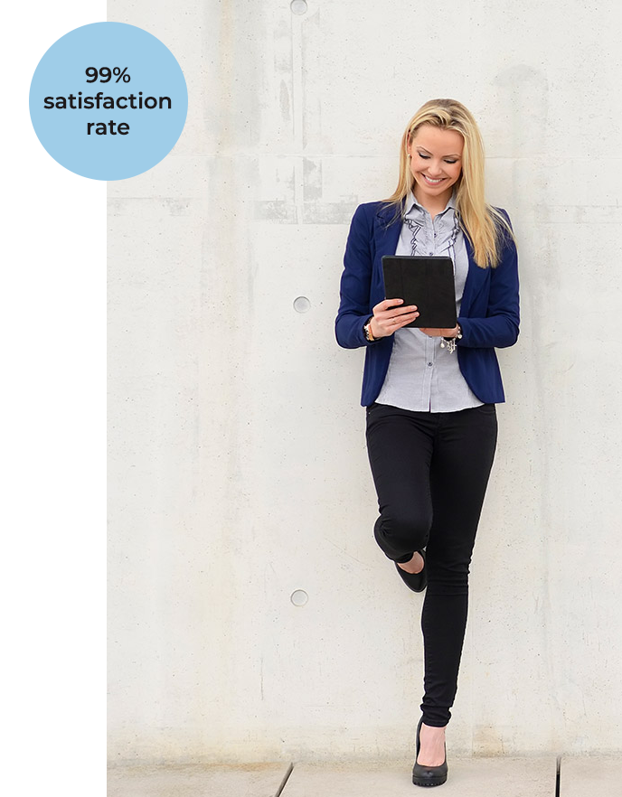 99% satisfaction rate - woman leanin on wall, smiling down at her tablet